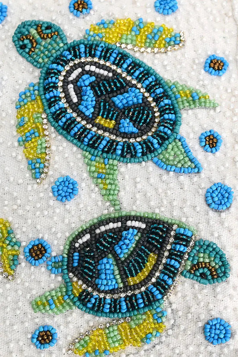 Shop the stylish beaded Marine Terrain Bucket Bag – a unique blend of modern design and luxury craftsmanship. Perfect for adding a chic, luxurious beach coastal-inspired touch to any outfit. Get yours today!
