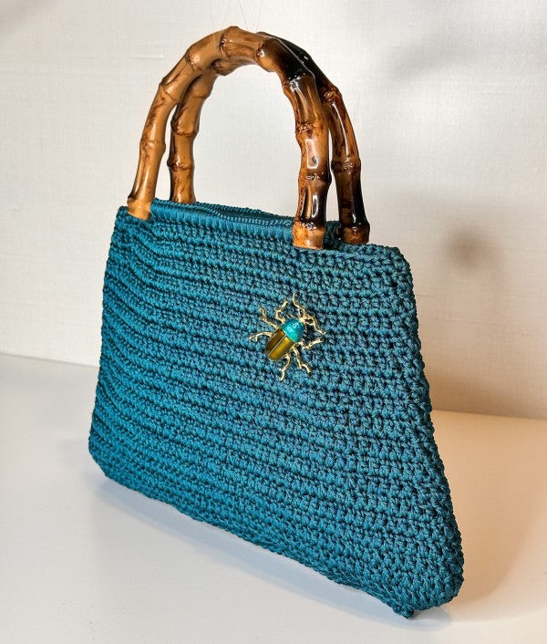 Bamboo handle handwoven bag